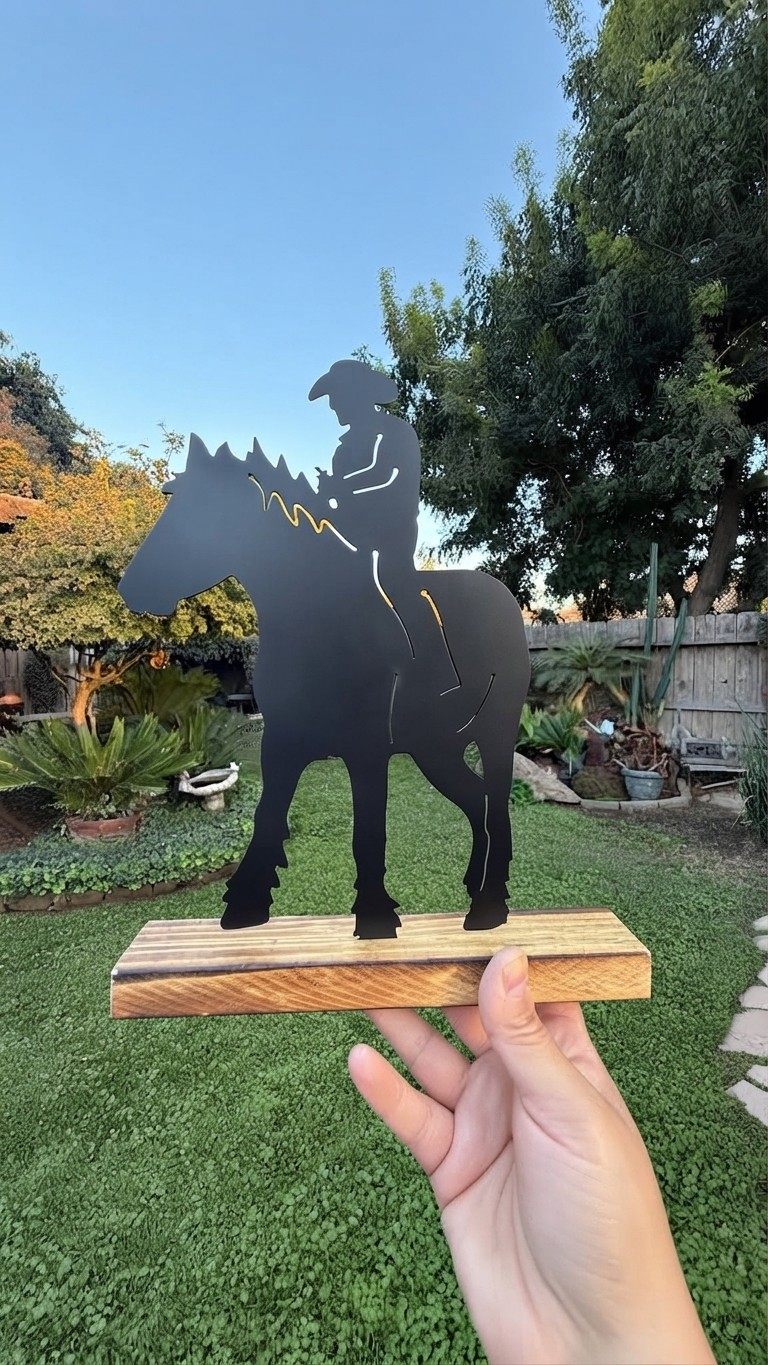 A steel silhouette of a cowboy on horseback.