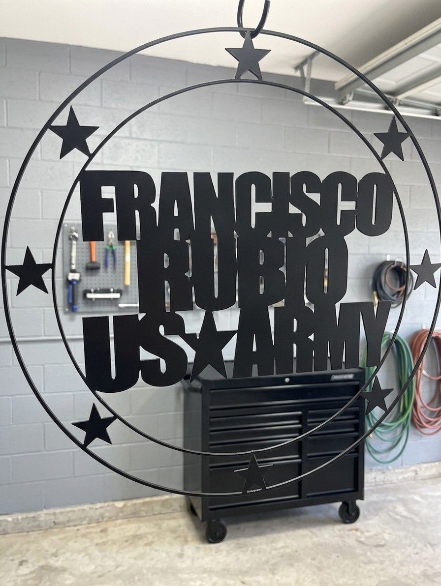 A steel ring reading Francisco Rubio, US Army, with stars.