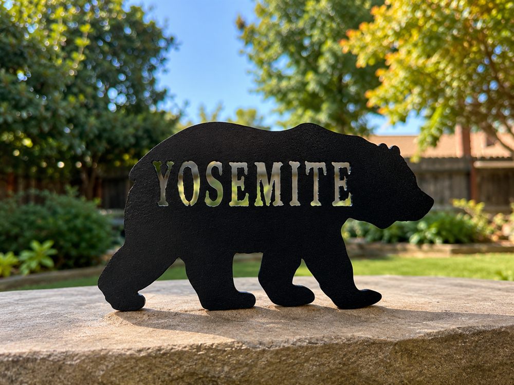 A steel bear with Yosemite cut through it.